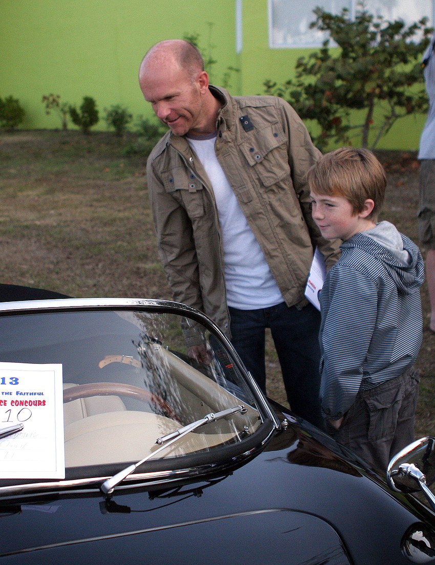 Toby Delbridge and his son Cooper, 9, have fun looking at all the Porsches, especially the speedsters.