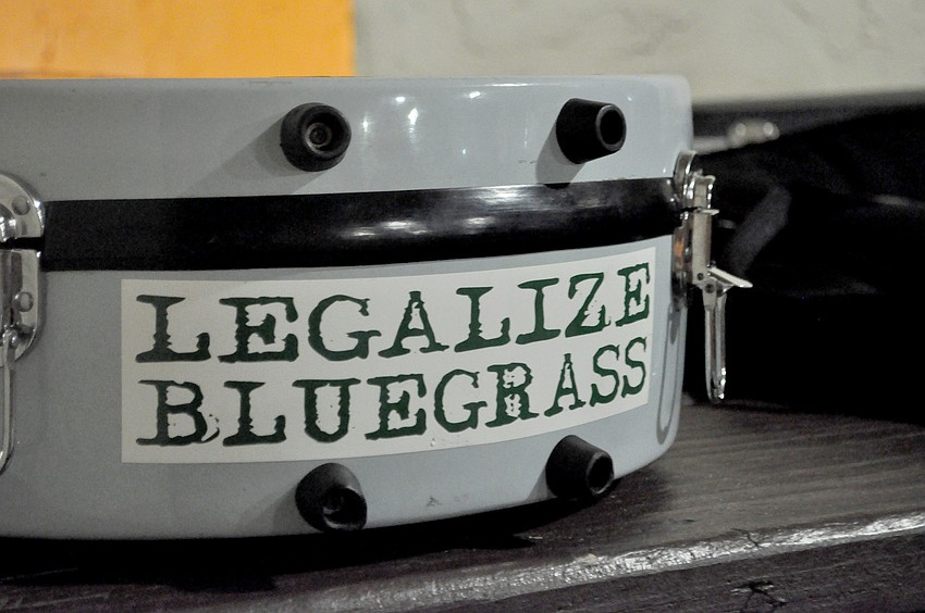 One musicianâ€™s guitar case displayed this bumper sticker.