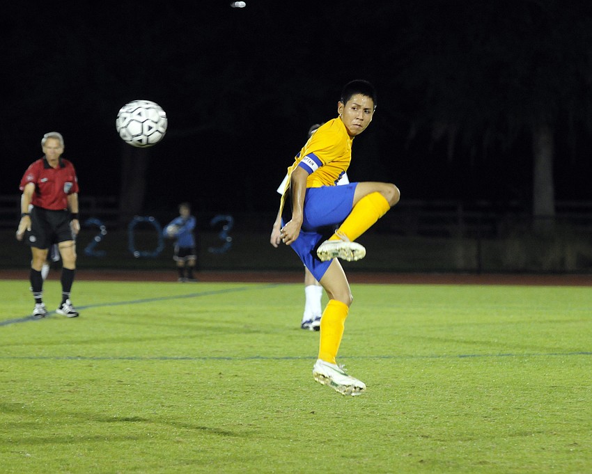 Sarasota Military Academy senior Leonardo Cisneros fires the ball to an open teammate.