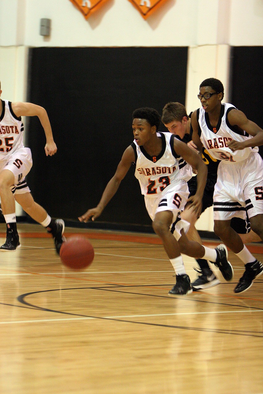 Sarasota High Schoolâ€™s Dakota Cotner, No. 23, dribbles the ball down the court.