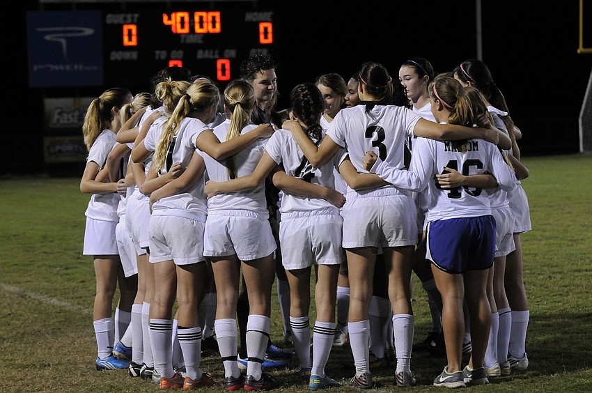 The Braden River girls soccer team huddles together before the start of its district quarterfinal match versus Charlotte Jan. 14.
