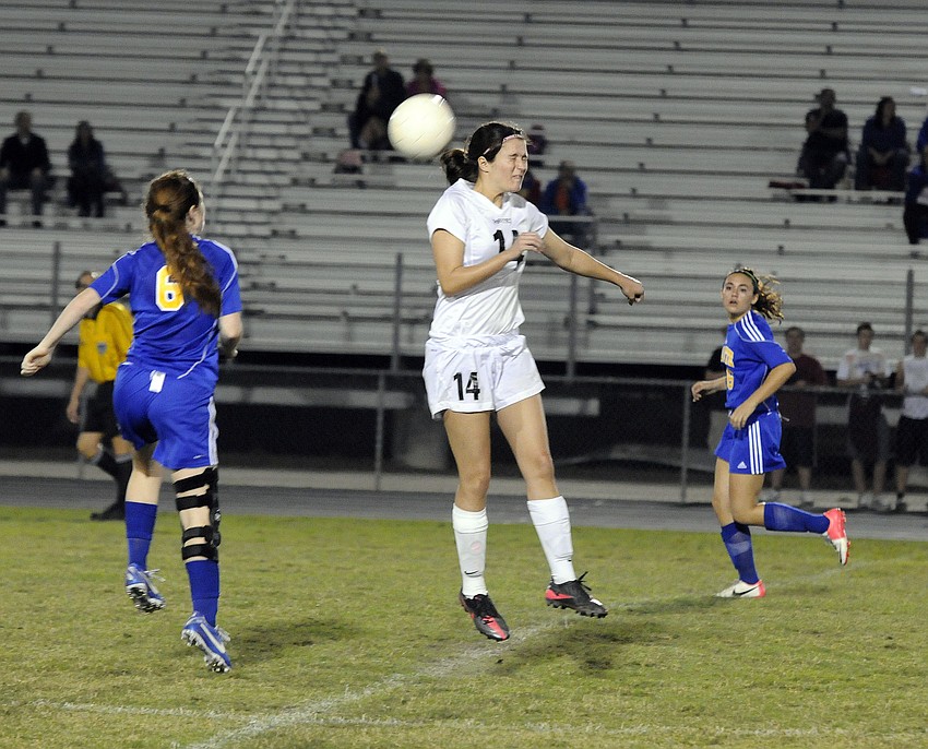 Braden Riverâ€™s Carly Provan heads the ball in the first half.