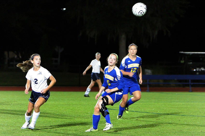 Out-of-Door Academyâ€™s Kimmy Comito, No. 2, along with Canterburyâ€™s Courtney Copeland, No. 5, and Paige Liebel, No. 12, all look to get to the ball.