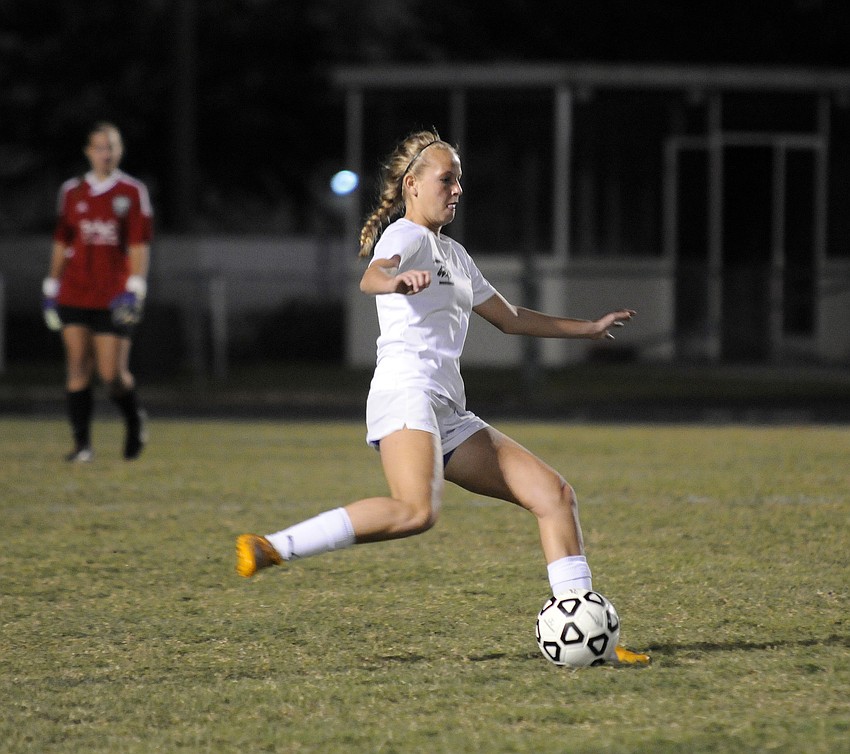 Lakewood Ranch defender Tatum Young prepares to pass the ball up field.