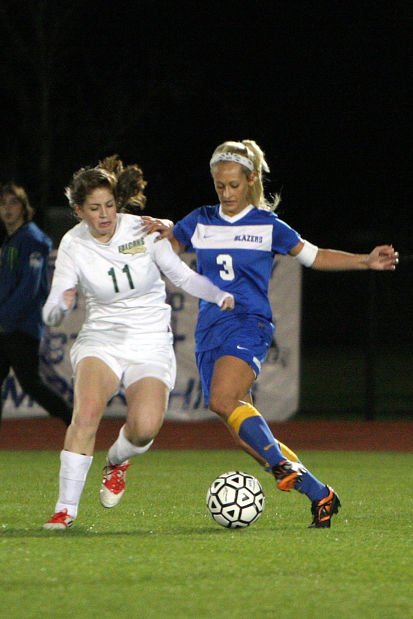 St. Stephenâ€™s Caroline Gregory, No. 11, and Sarasota Christianâ€™s Caris Miller, No. 3, fight for the ball.