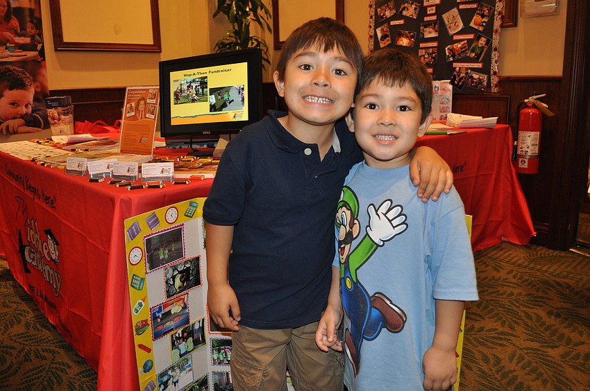 Evan and Carter Okuhara in front of the Kiddie Academy of Lakewood Ranch station