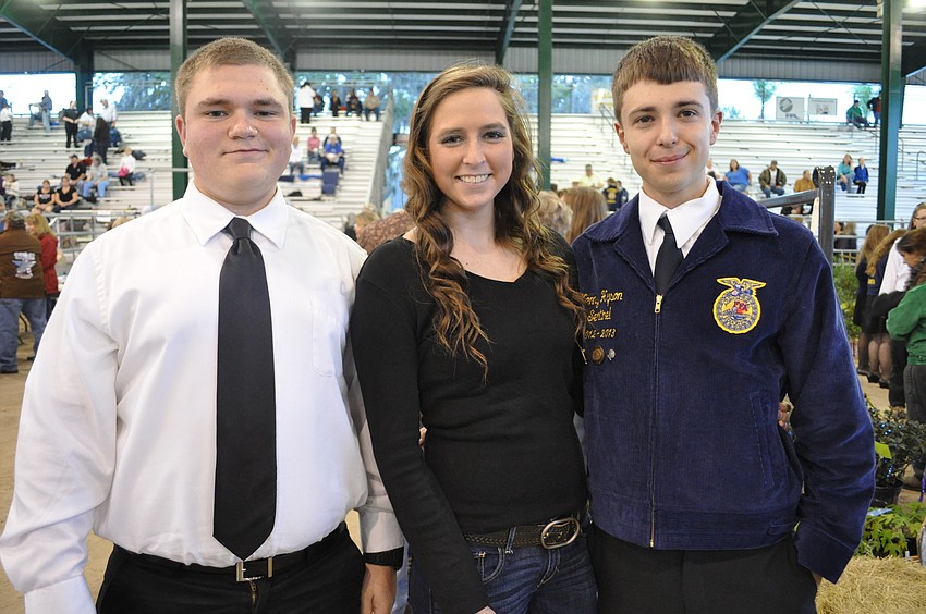 Caitlin Dixon, center, came out to support friends Nick Kersey, left, and Kenny Hyson, right, as they showed plants in the fair.