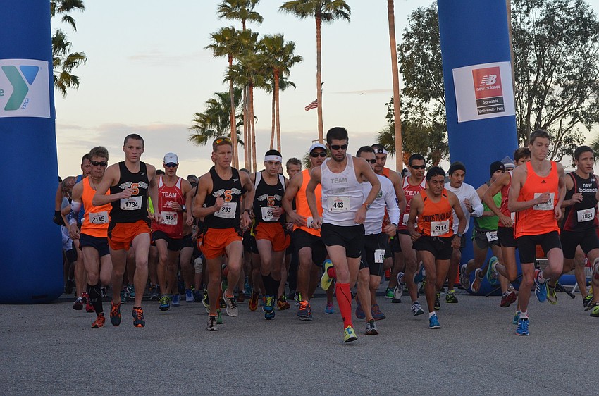Runners take off at the sound of the gunshot.