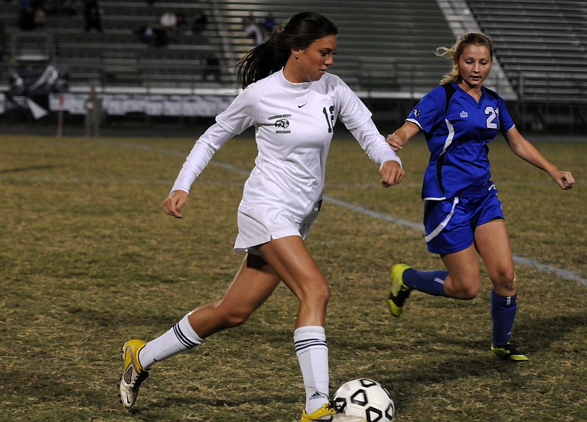 Lakewood Ranch senior Chelsea Martin pushes the ball up the field in first half.