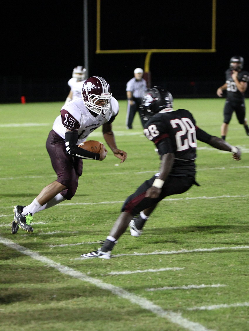 Austin Walker, No. 17, tries to get around Caleb Ford, 28.