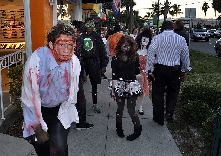 Sarasota High Schoolâ€™s Drama Department scared the circle by walking around and acting like zombies prior to performing Thriller Wednesday, Oct. 31, on St. Armands Circle.