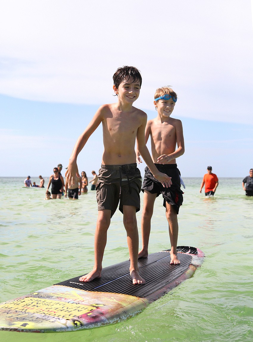 Dominick Baron, 8, and Julian Repetto, 8, have fun riding together.