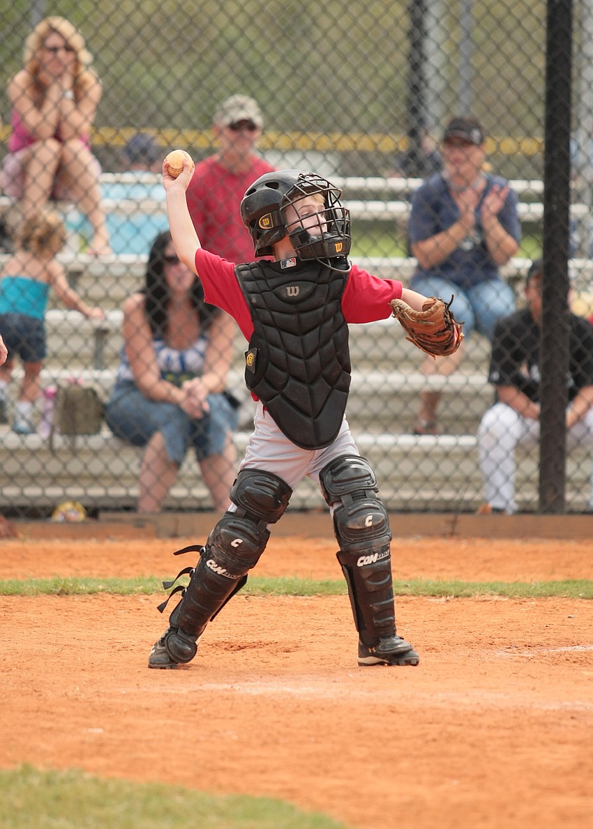 Connor McCray plays catcher for the Reds.