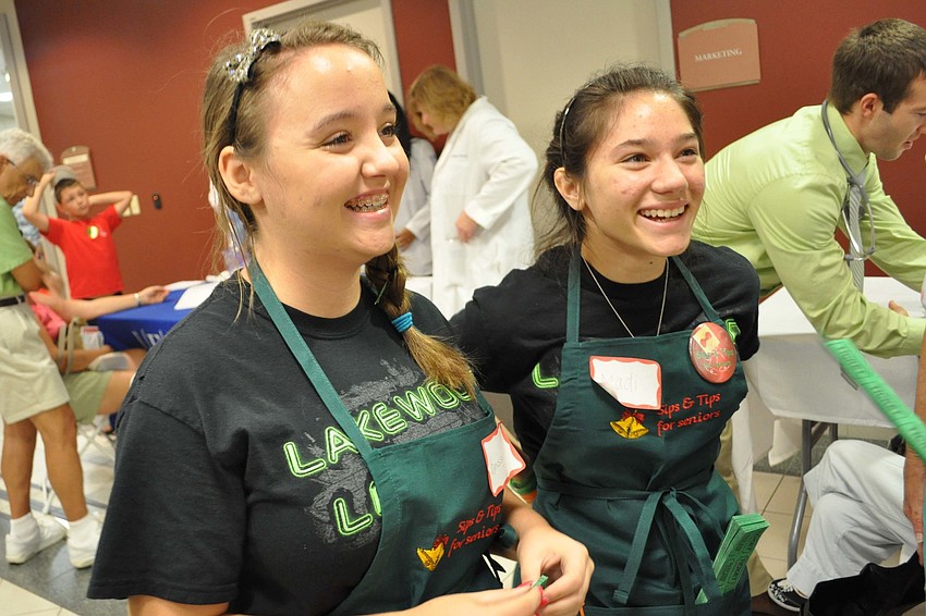 Krissy Weinzierl and Madi Cheri, of Lakewood Ranch High Schoolâ€™s Lakewood Leaders group, helped sell raffle tickets.