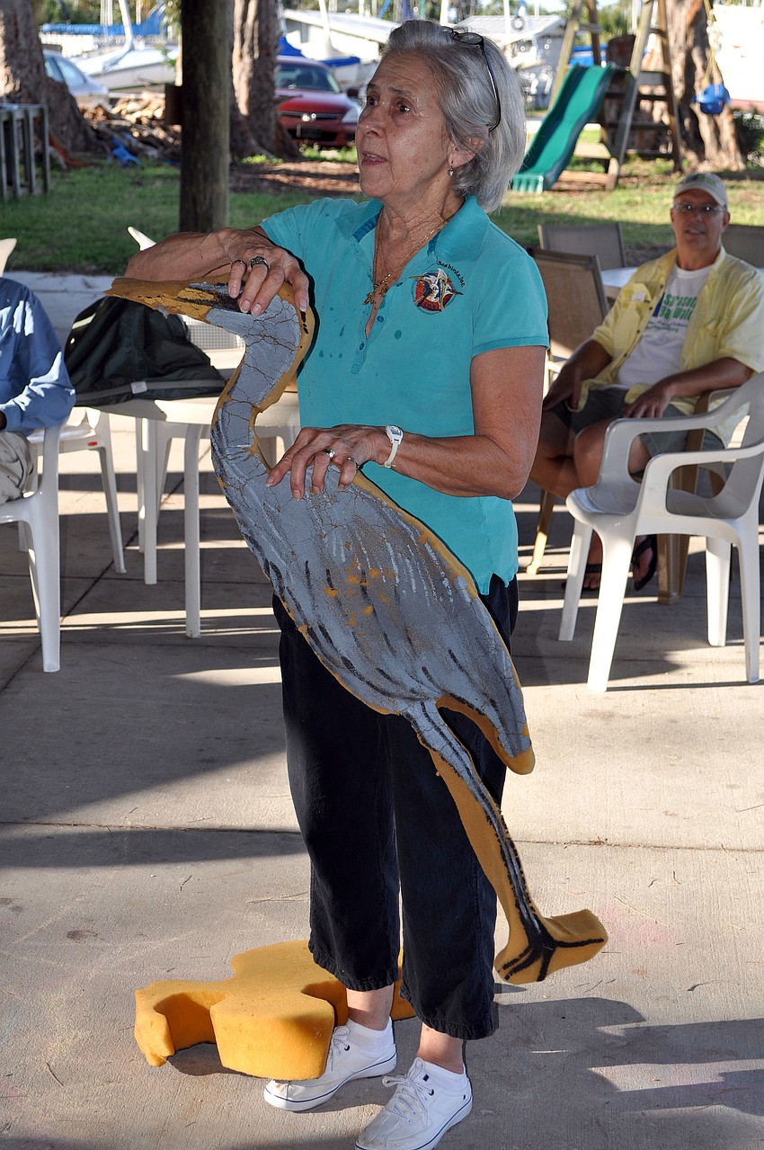 Lee Fox of Save Our Seabirds uses a foam cut out of a heron to explain what to do if volunteers run into a bird caught up in monofilament.