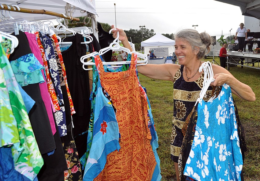 Jill Evans puts out her apparel for people to try on and buy Wednesday, Oct. 3, the opening day of the Phillippi Farmhouse Market.