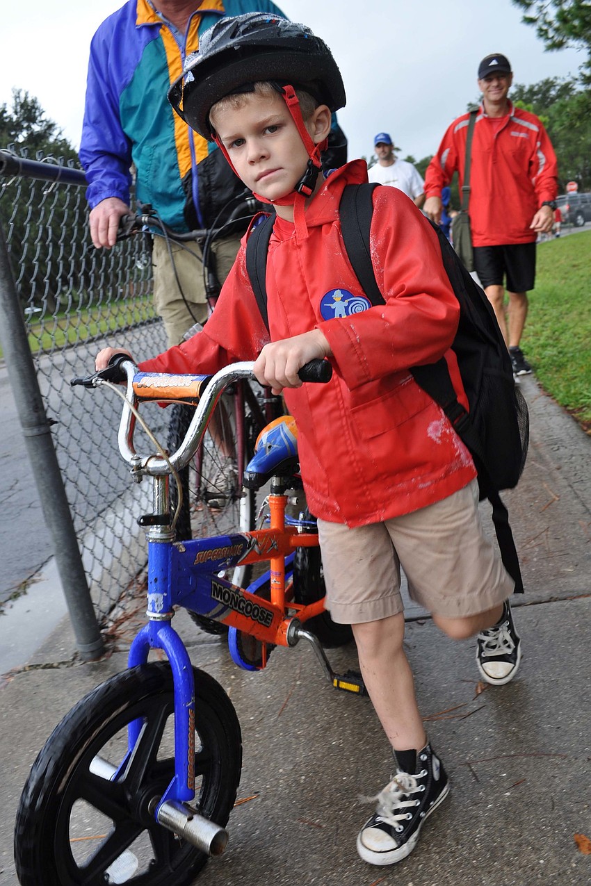 Kameron Davenport, 7, rode in alongside his brother and dad.