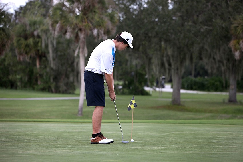 Reid Ferguson, 15, of Sarasota Christian, practices his putting prior to playing Tuesday, Oct. 9, at Bent Tree Country Club.