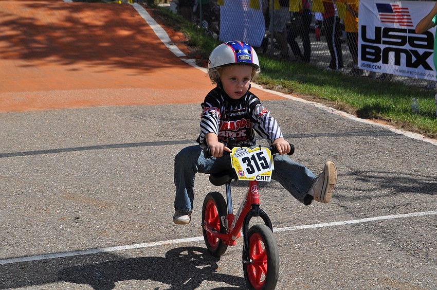 Sebastian Fleener puts his feet in the air as he crosses the finish line