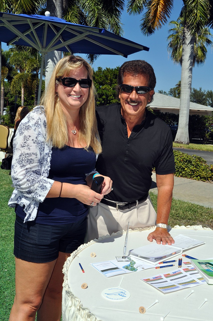 Ruth and Ralph Ciasullo sign the guest book at the Hal and Hazel Lenobel Appreciation Day picnic Sunday, Oct. 21, at the Longboat Key Club Harbourside.