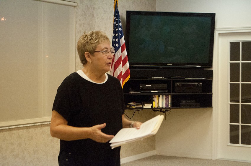 Garden Club member Sarah Tate introduces guest speaker Joe Mathis.