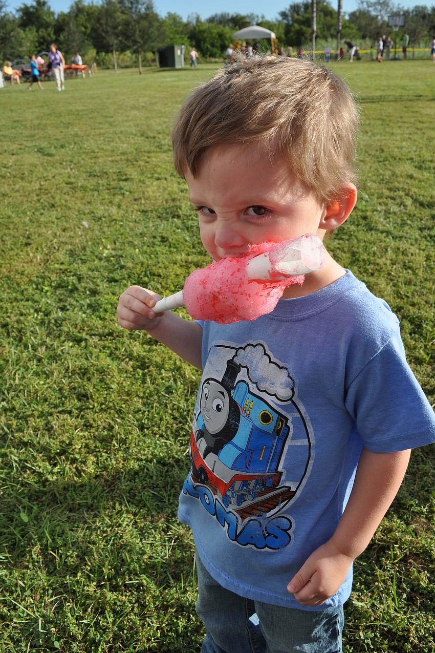 Ori Hall, 3, feasted on cotton candy.