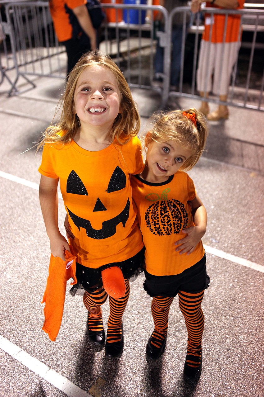 Bella, 5, and Carmella, 3, Frederick wore orange for Halloween and the Sarasota Sailors.