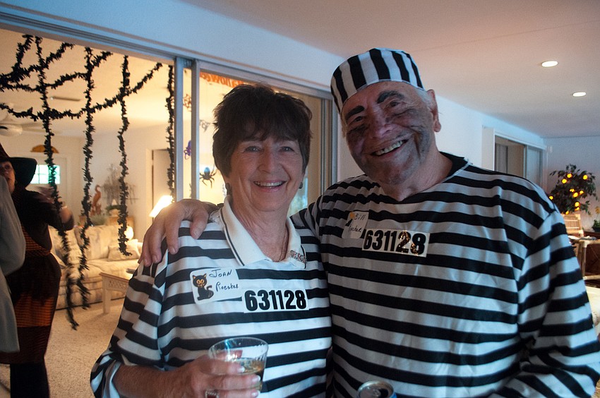 Joan and Bill Roecker dressed as prisoners.