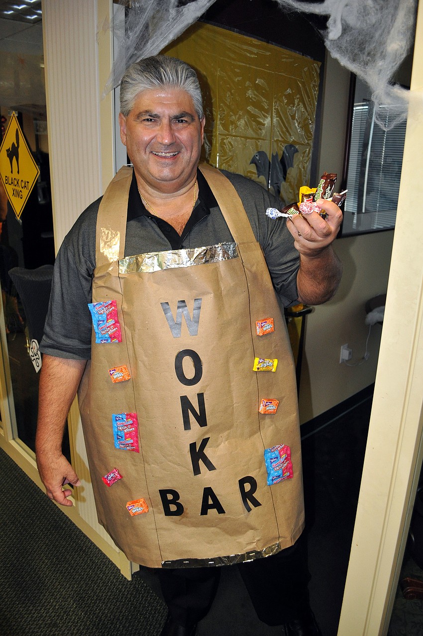 Al Caliendo dressed up as a Wonka Bar while passing out candy to the girls Wednesday, Oct. 31, at UBS.