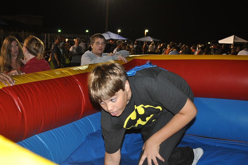 Erick Bernard recovered after sliding down an inflatable slide.