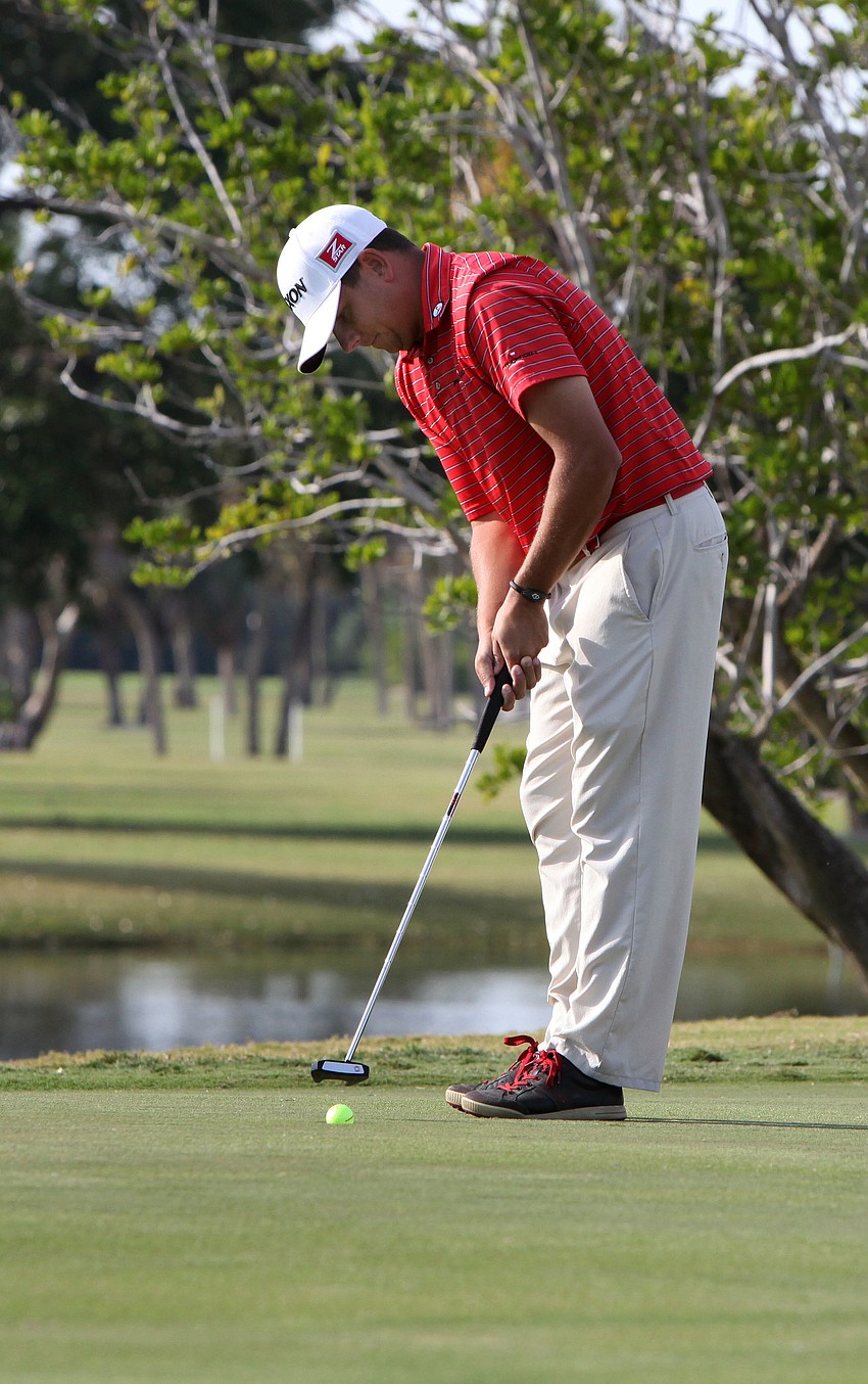 Johann Benson putts his ball into the 18th hole on the final day of the Longboat Key Open.
