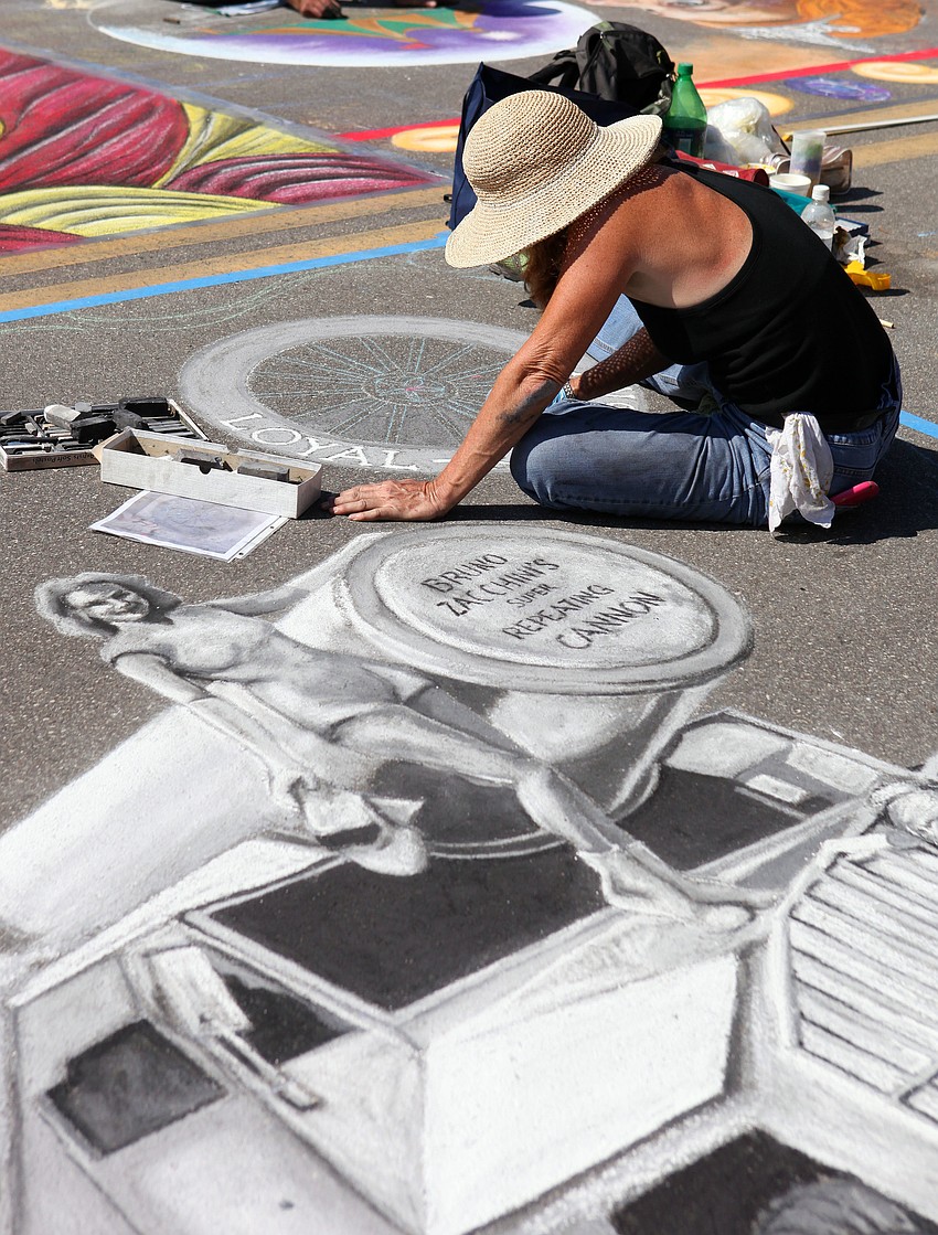 Jessica Dirkes works on her piece that she based off of a black and white photograph.