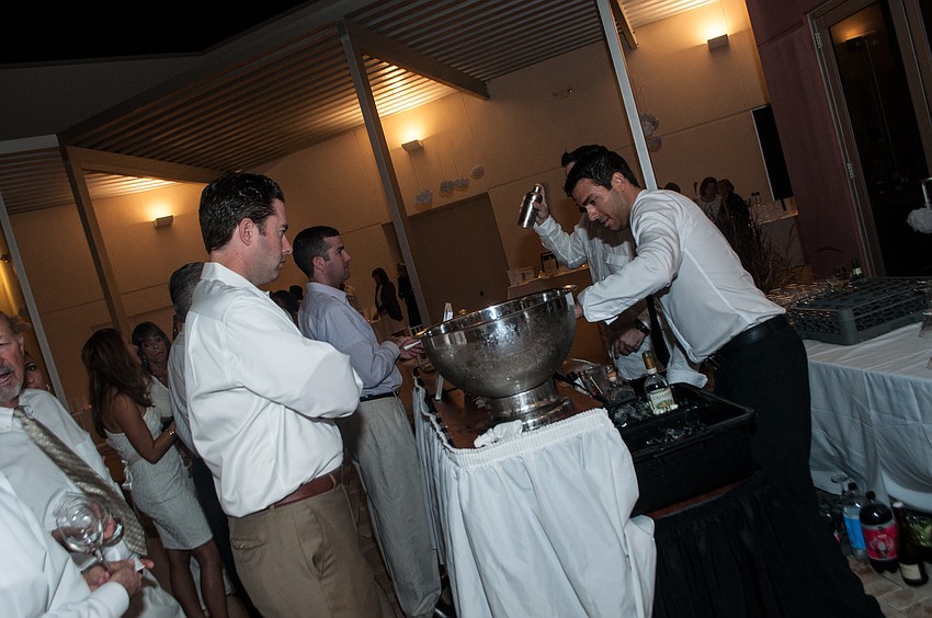 Bartenders prepare drinks for the guests