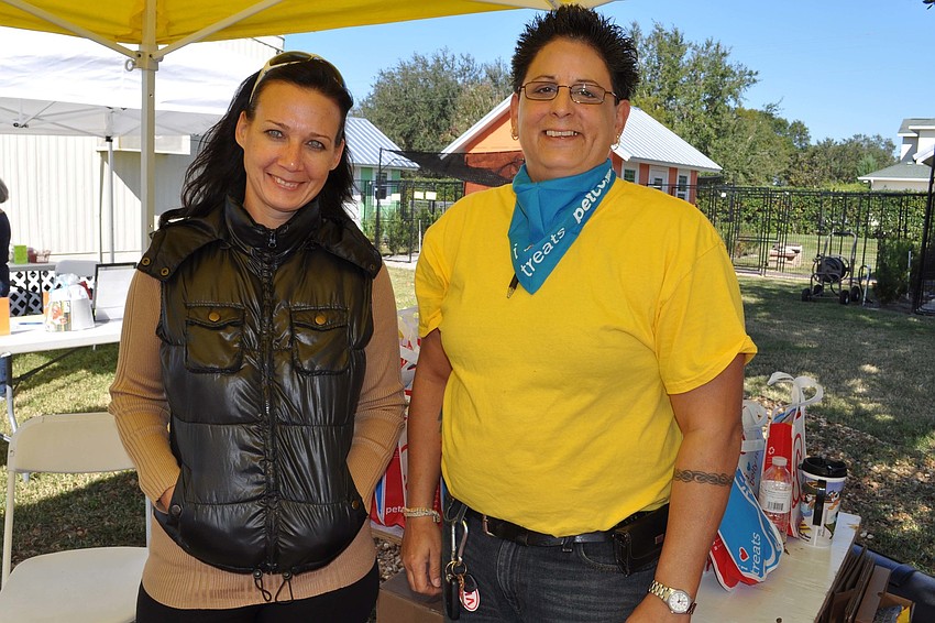 Volunteer Cheryl Homer and Petco General Manager Tricia Conenello offered attendees a chance to win give-aways.