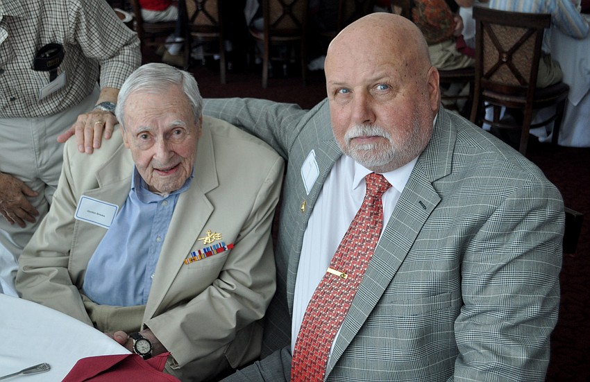 95-year-old Iwo Jima veteran and member of the U.S. Navy Frogmen Gordon Brooks sits with Ed Bush