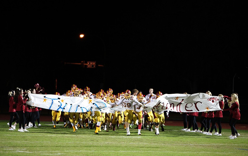 Cardinal Mooney runs out onto the field.