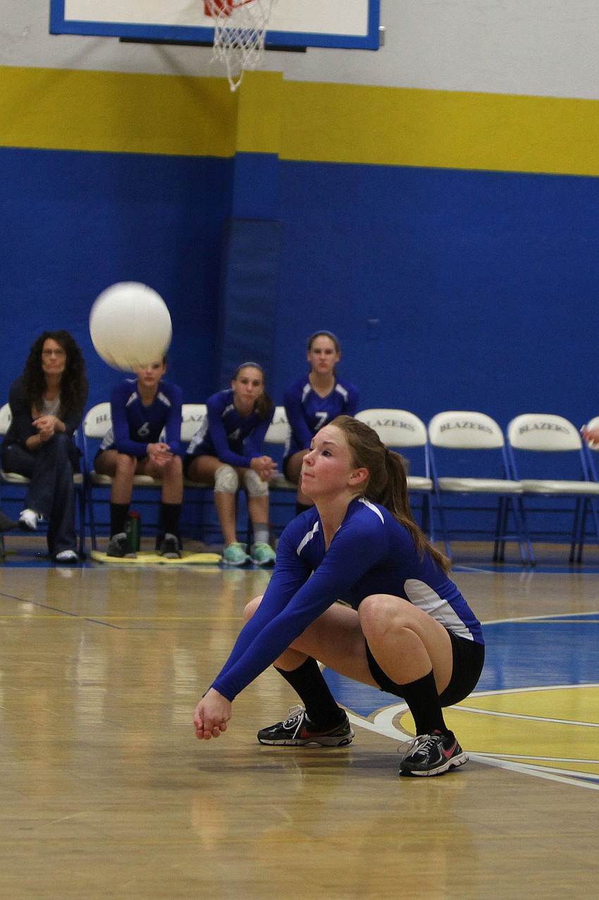 Heidi Miller, No. 5, bends down low to get to the ball.