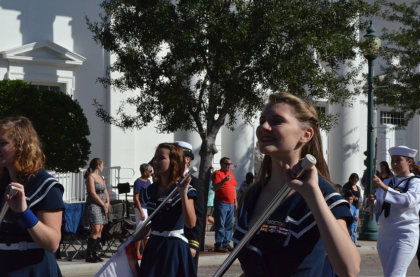 The Sarasota High School color guard march in the parade.