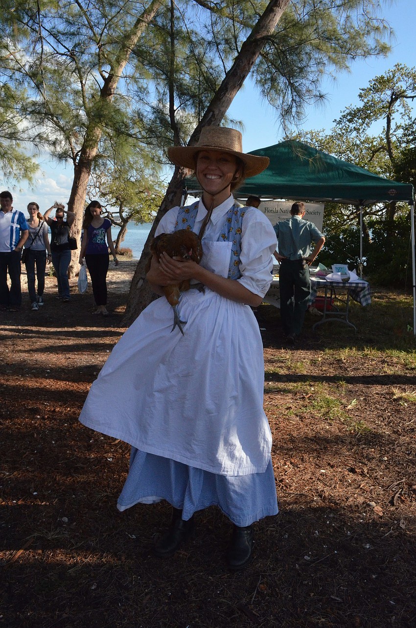Haromy Poire holds 1 â€“ year-old chicken Sara. Sara came from the Crowley Museum and Nature Center.