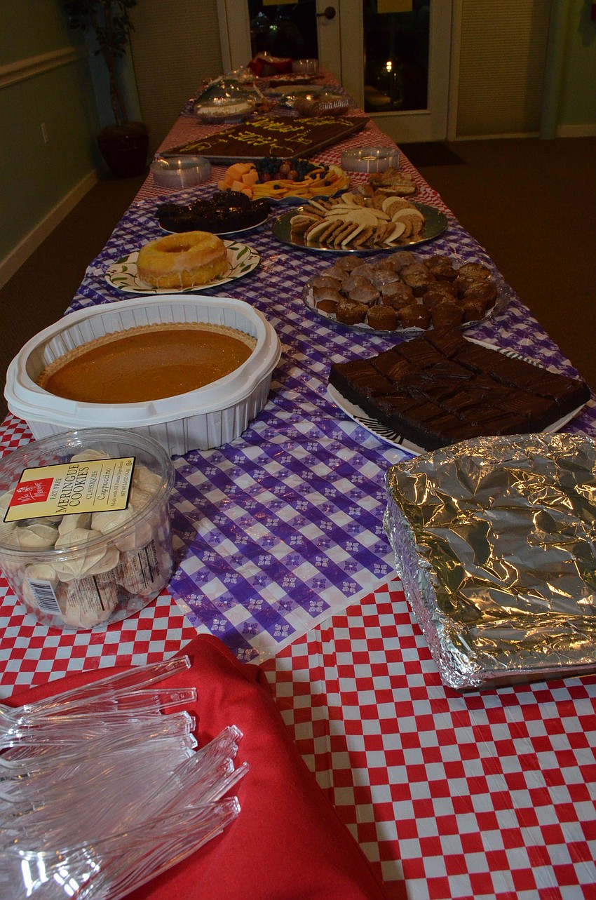 Members chose sweets from the dessert table.