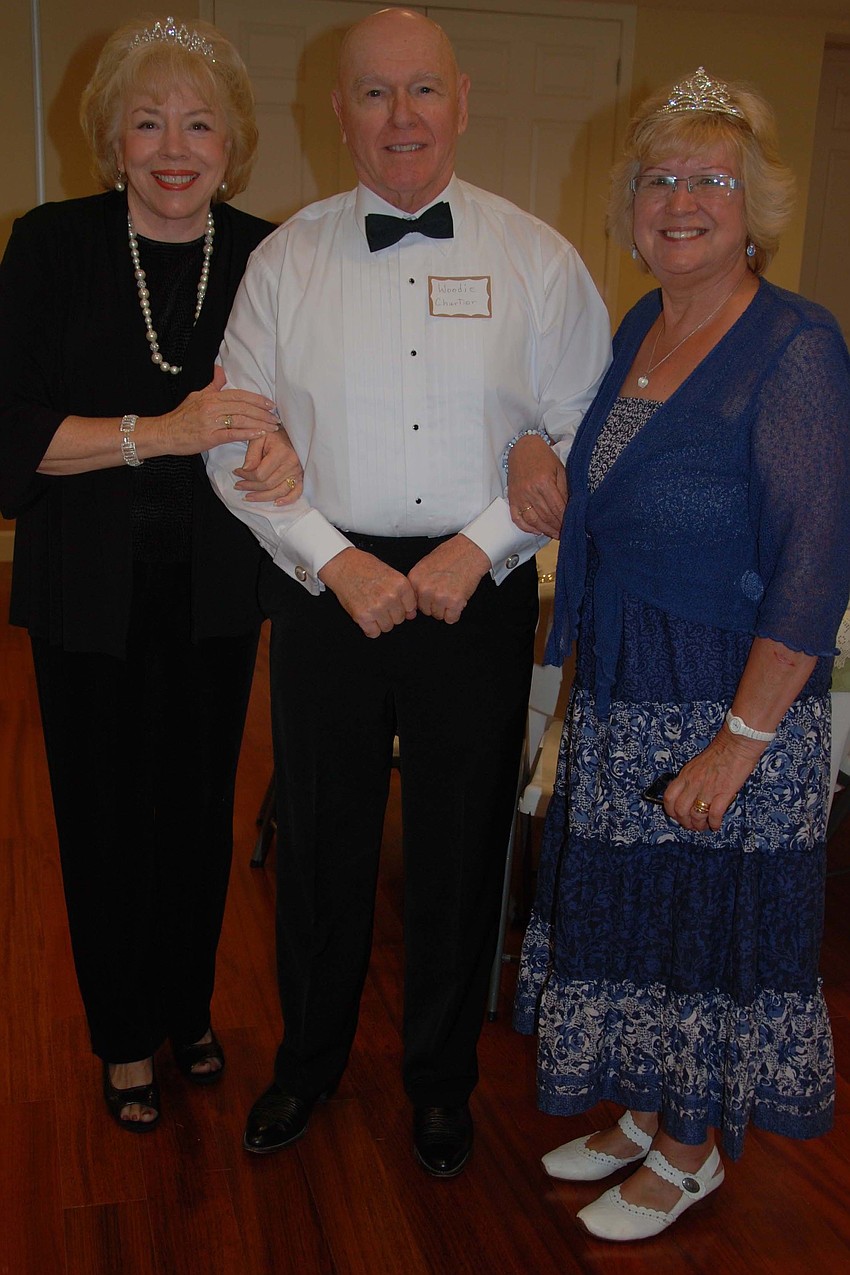 Woodie Chartier escorted guests Betsy Chartier and Joan Langham to their table.