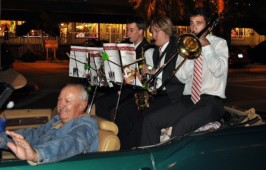 Members of the Pine View Jazz Band performed Christmas songs in the back of a convertible during the parade.