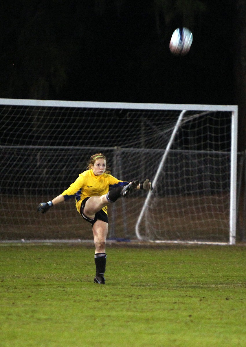 Sarasota Christianâ€™s goalie Rebecca Brigham kicks the ball out onto the field.
