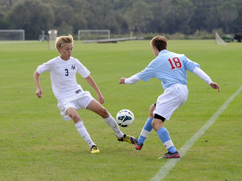 Lakewood Ranchâ€™s Jack Dube battles a Tampa King player for possession during the Mustangs 1-0 victory over the Lions Nov. 20.