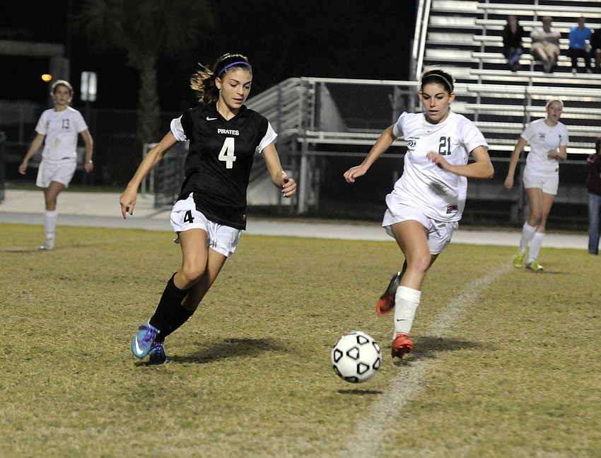 Braden Riverâ€™s Brittney Rangel and Lakewood Ranchâ€™s Angelica Rego race to the ball in the first half.
