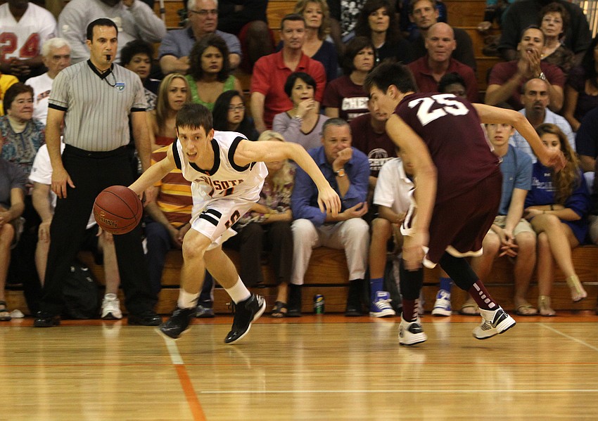 Sarasotaâ€™s Blake Haga, No. 12, works to get around Riverviewâ€™s Nick Havener, No. 25.