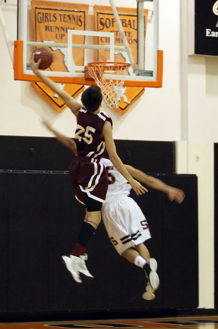 Riverview Nick Havener, No. 25, dunks during Riverviewâ€™s game against Sarasota Monday, Dec. 3, at Sarasota High School.