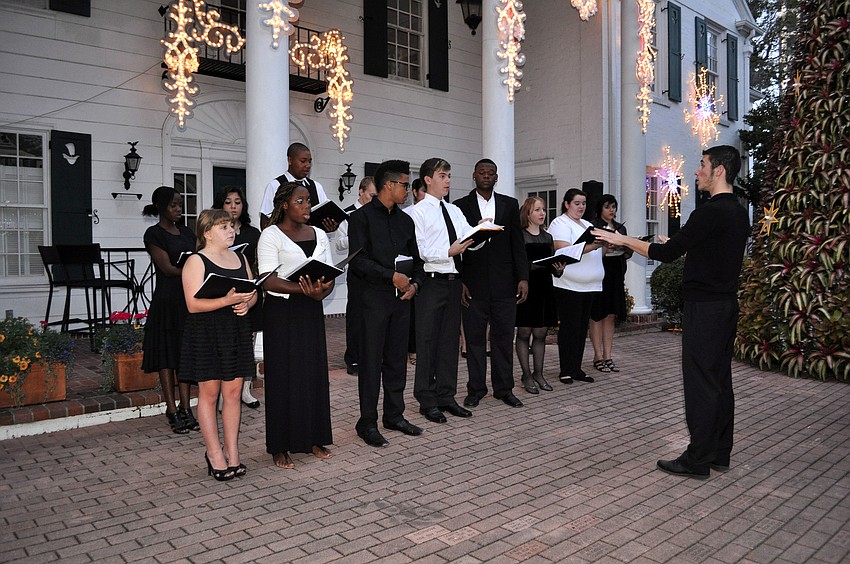 The Booker High School choir performed a variety of holiday songs prior to the tree being lit.