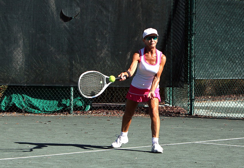 Francoise Beaurpere warms up on the court.