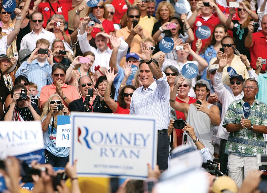 Presidential candidate Mitt Romney waves to the cheering crowd, Sept. 20, at the John and Mable Ringling Museum of Art.